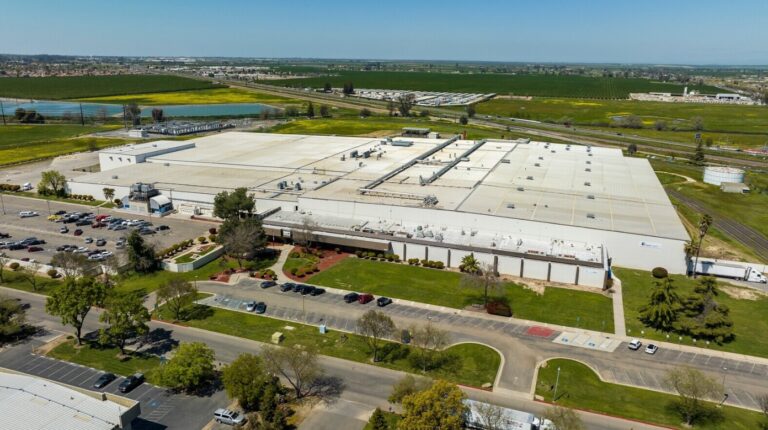 Large rail-served industrial manufacturing facility in Merced, California leased by Industrial Realty Group to an agricultural manufacturer.