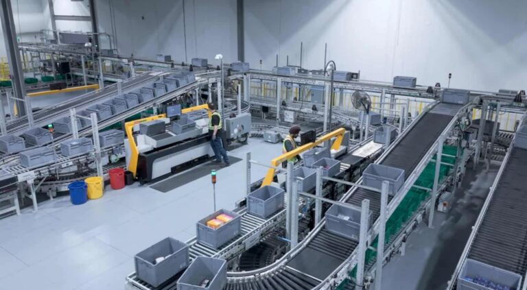 Automated storage and retrieval system with goods-to-person workstations inside Pattison Food Group's grocery distribution centre in Langley, British Columbia.
