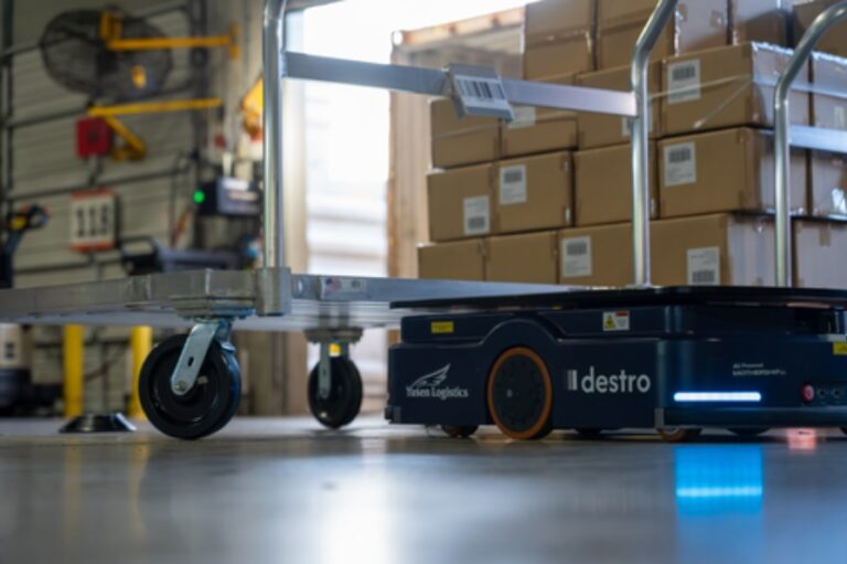 Warehouse robot operating in a fulfillment center with software used to coordinate automation workflows.
